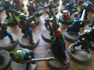 A dastardly psyker and his cultist retinue.